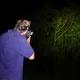 Wildlife biologist Adam Knox demonstrating the use of an airsoft gun to stun invasive brown tree snakes.